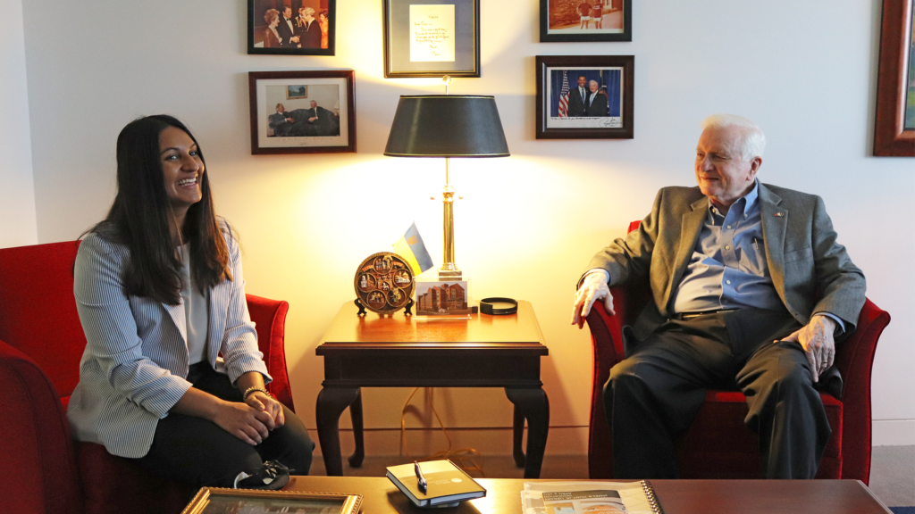 Hunt Intern Shevani Mehta and Governor James B. Hunt, Jr. sit together in conversation.
