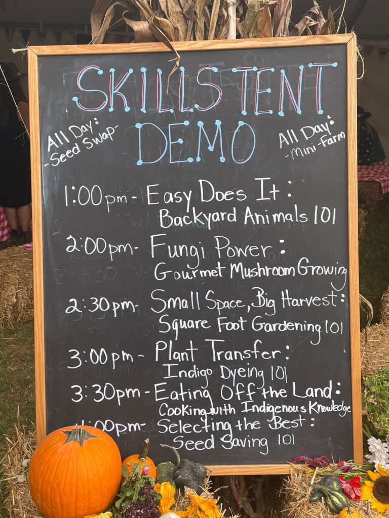 A chalk board displaying a list of activities taking place at a "skills tent"