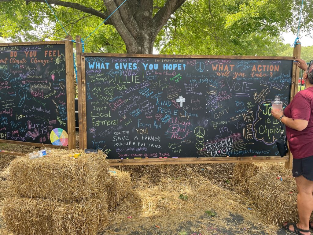 A chalk board displaying handwritten answers to "what gives you hope" and "what action will you take"